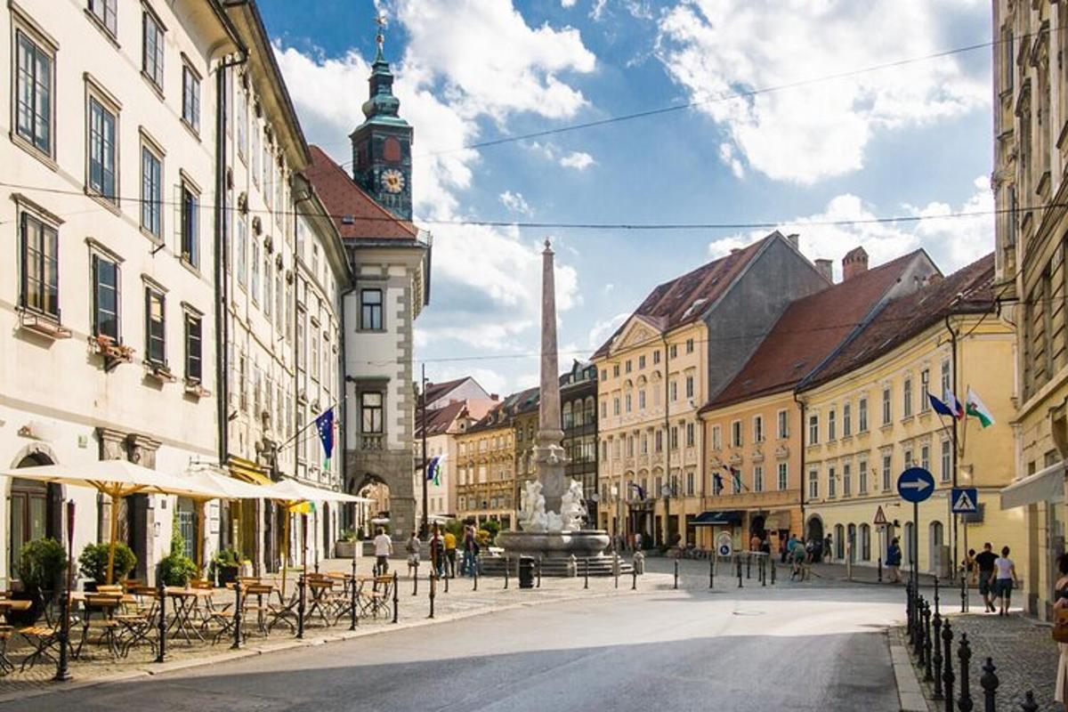 a city street with buildings and a clock tower