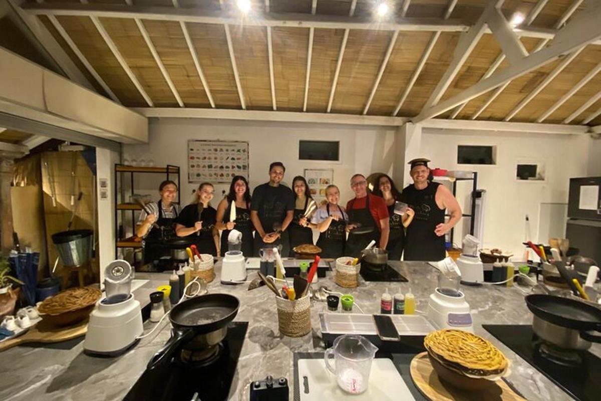 a group of people standing around a table