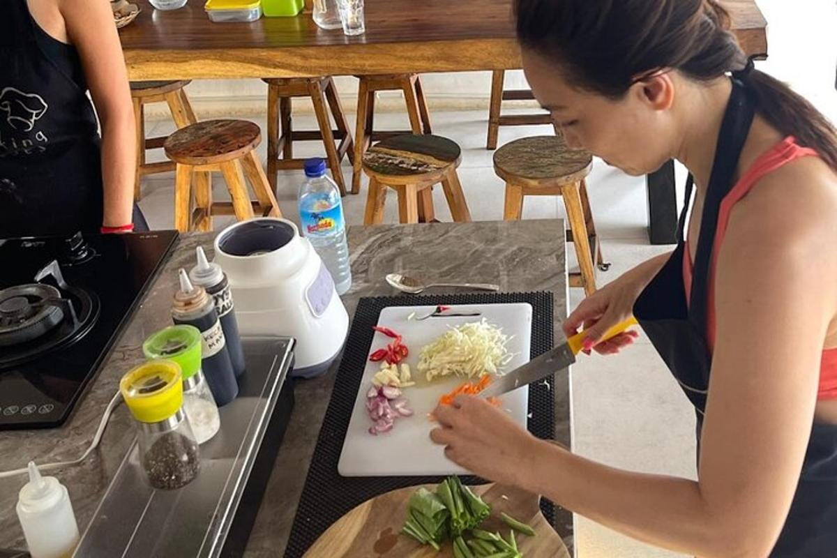 a woman cutting food on a plate with a knife