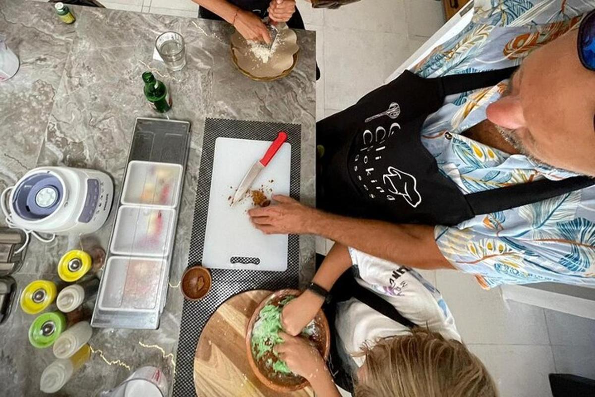 a man is painting a piece of paper on a table