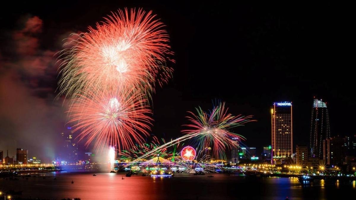 a fireworks display over a city at night