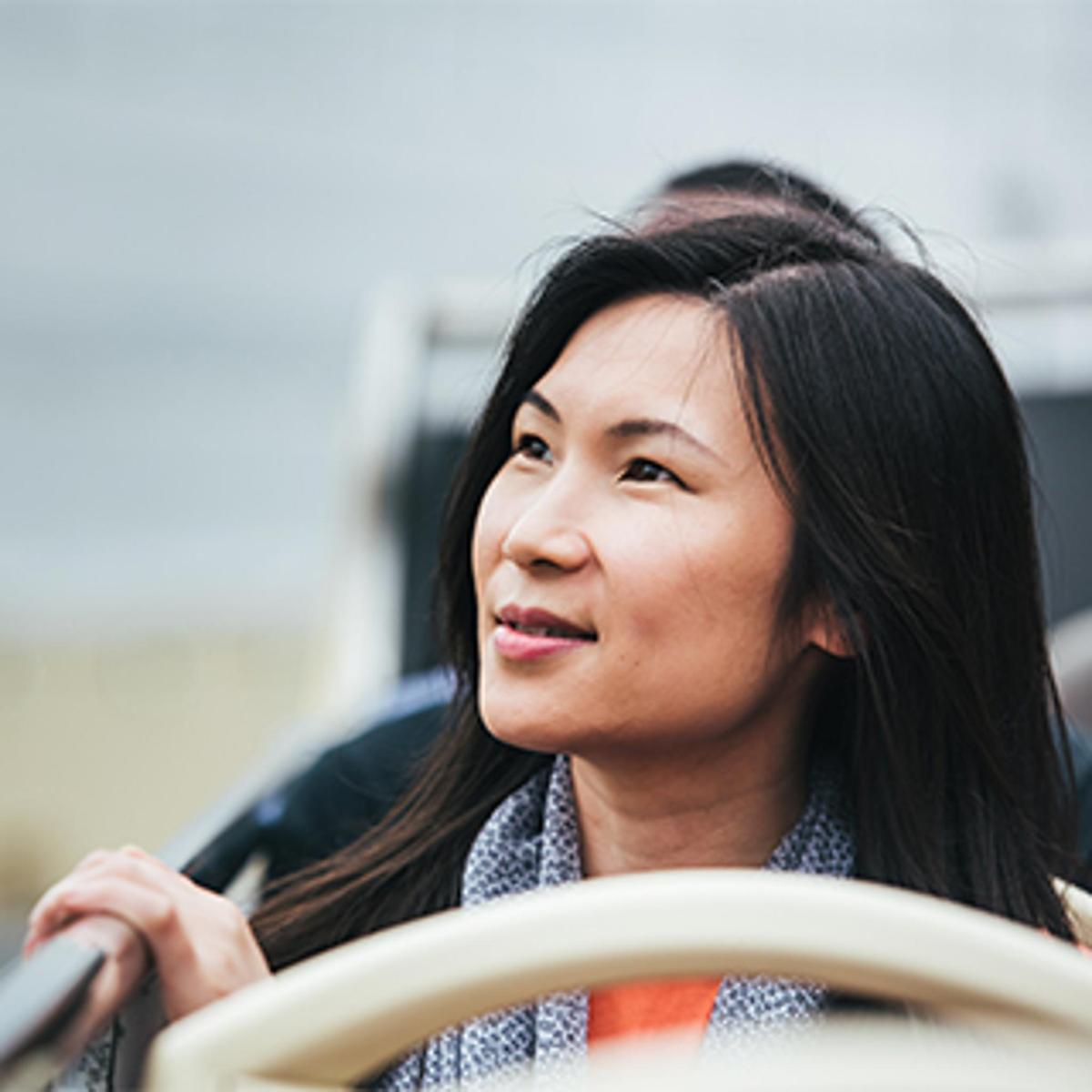 a woman sitting at a table with her hair