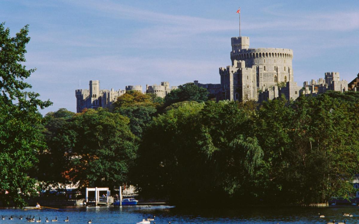 a view of a city from the water with a castle