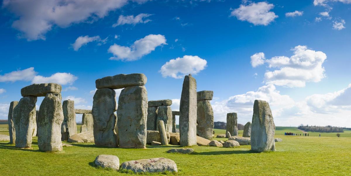 an image of an ancient stonehenge monument in a field