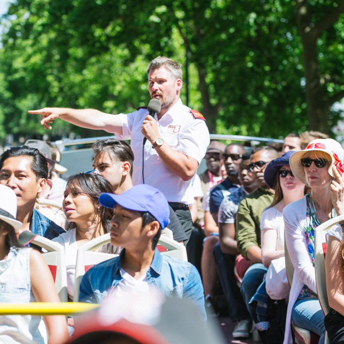 a man holding a microphone in a crowd of people