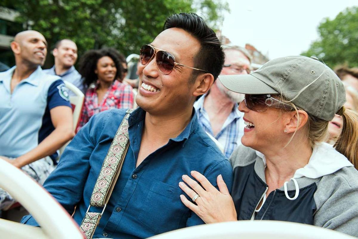 a man and a woman sitting in a crowd of people