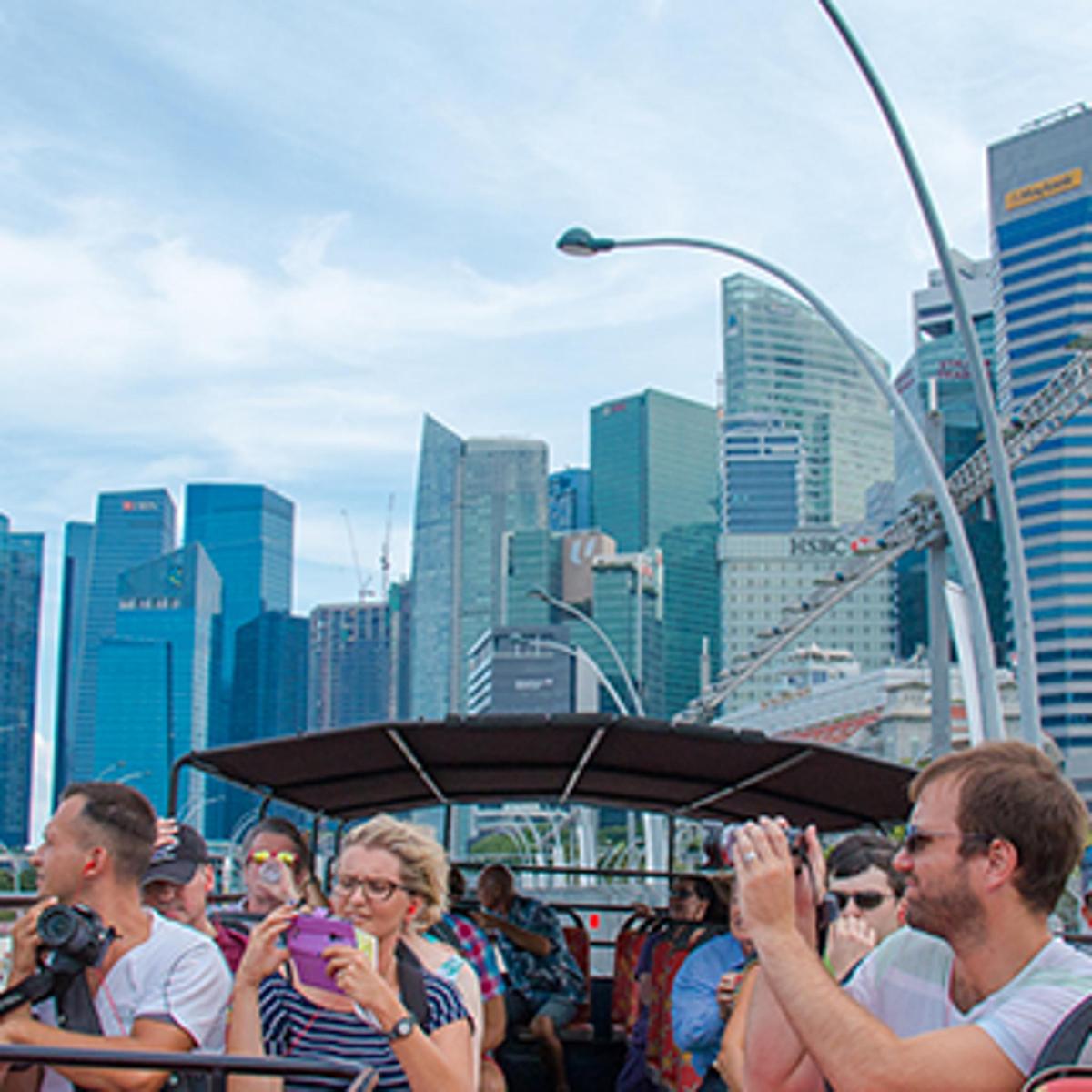a group of people on a boat in a city