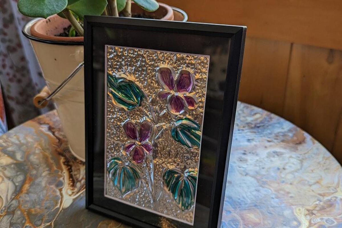 a picture of a painting of flowers on a table