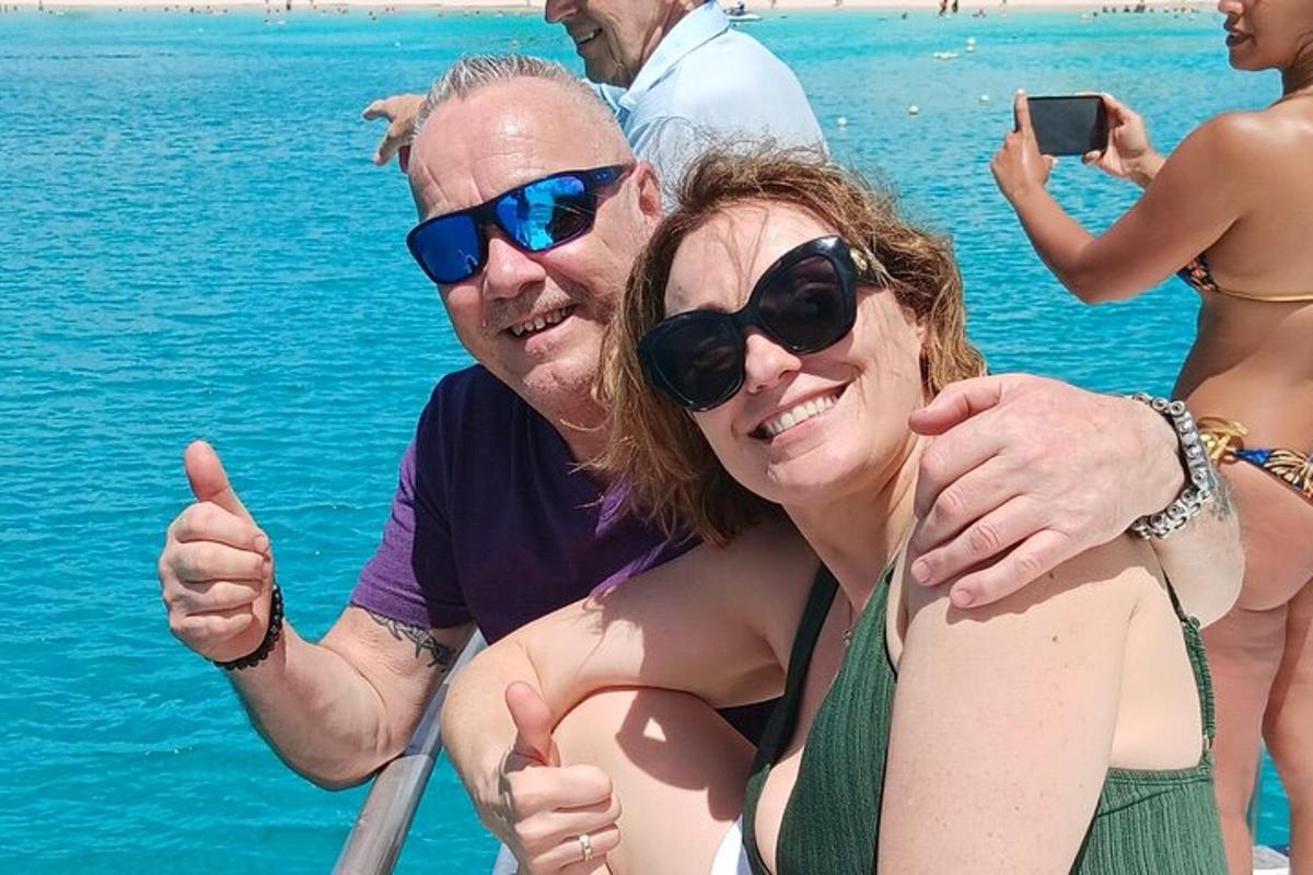 a group of people on a boat in the water
