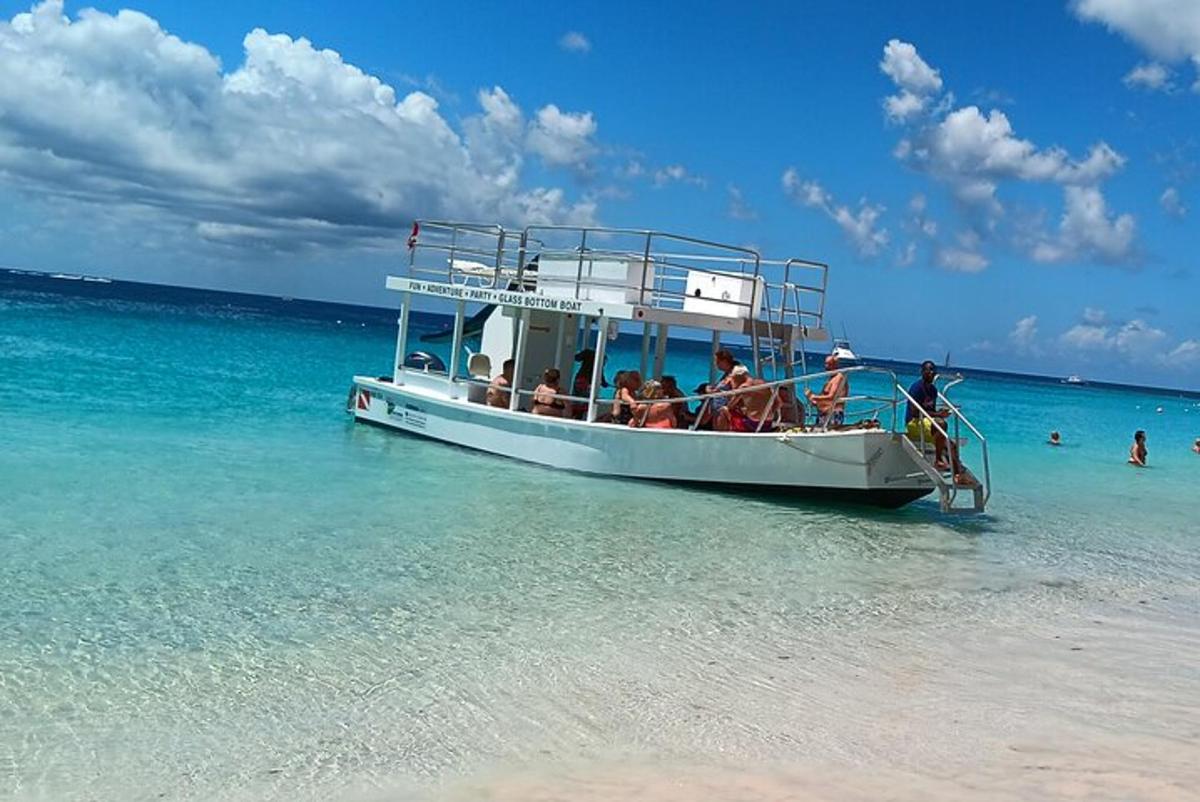 a group of people on a boat in the ocean