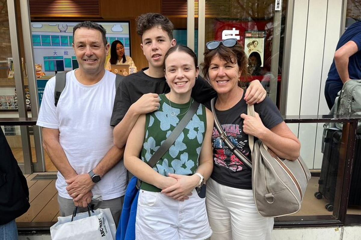 a group of people standing in front of a store