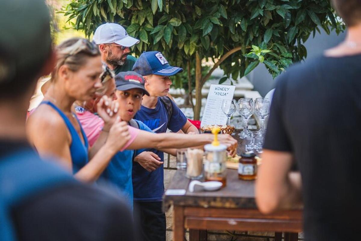 a group of people standing around a table