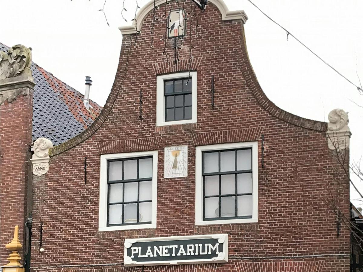 a tall brick building with a clock on top of it