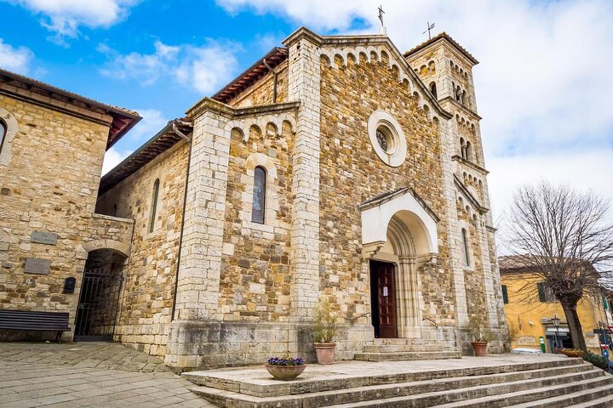 uma velha igreja de pedra com escadas na frente
