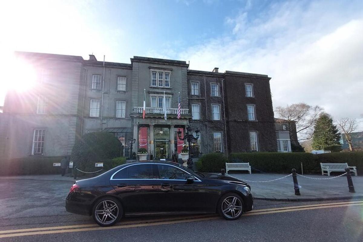 a black car parked in front of a building