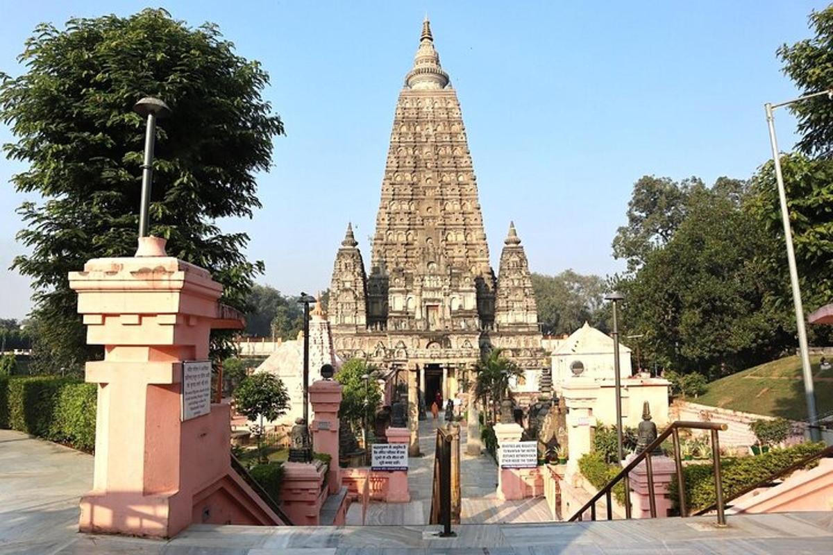 a temple with a tall tower in the background