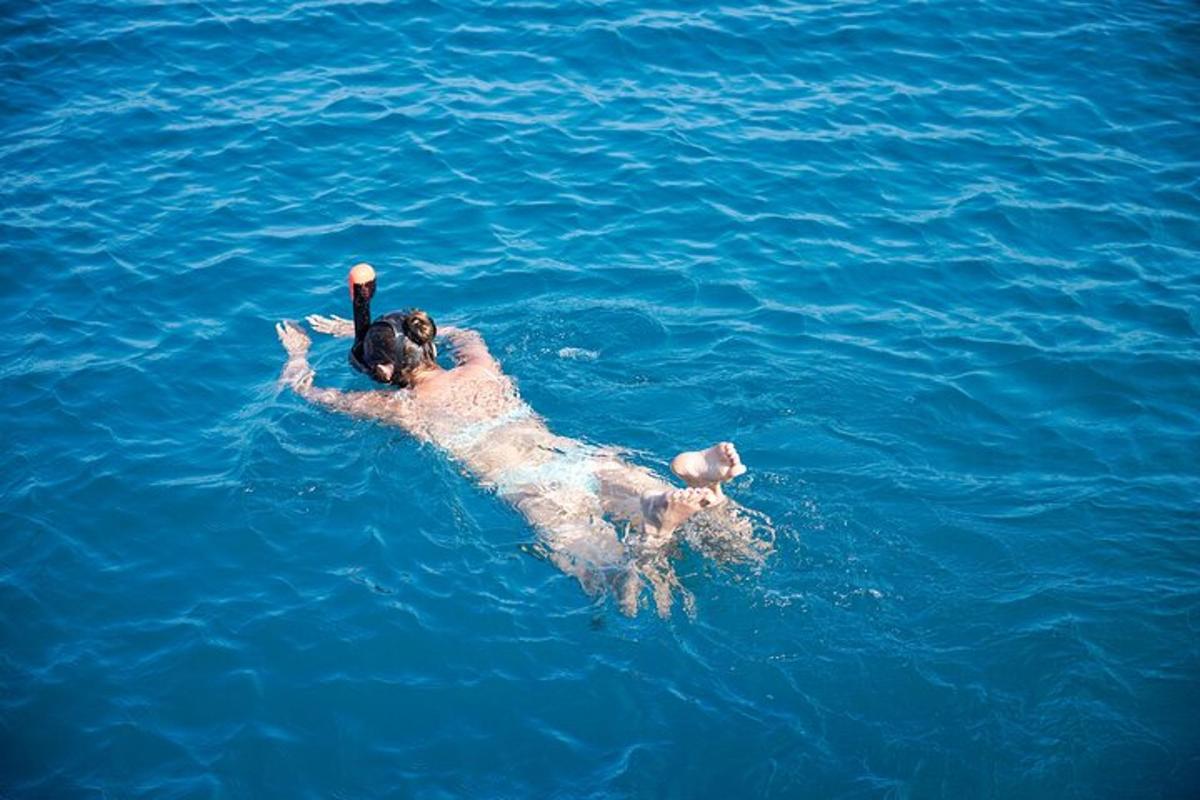 a man laying on his back in the water