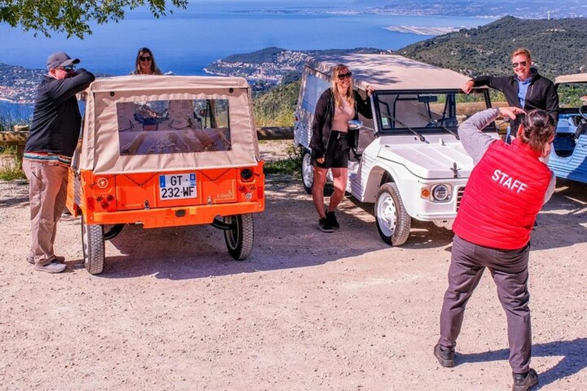 a group of people standing next to a jeep