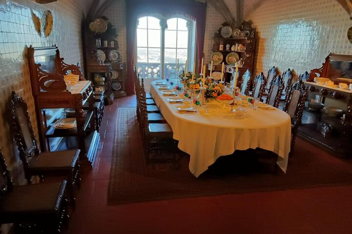 a dining room with a long table and chairs