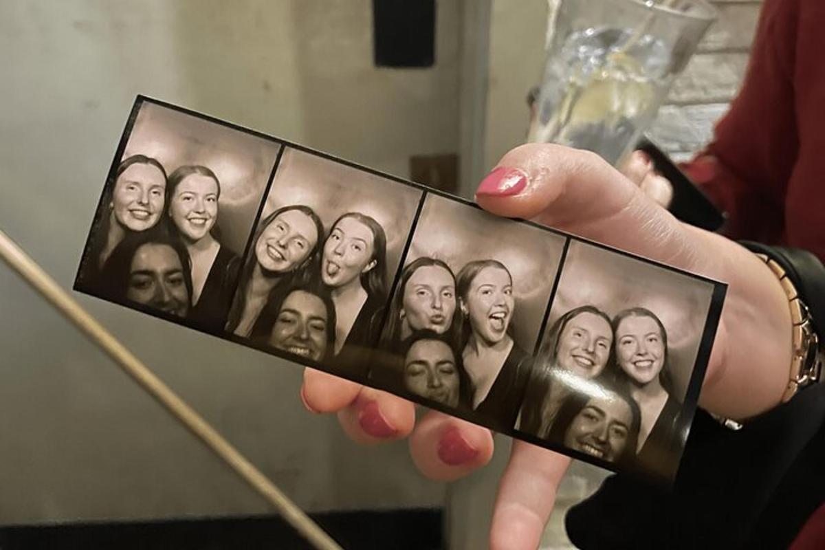 a person holding a cell phone in their hand
