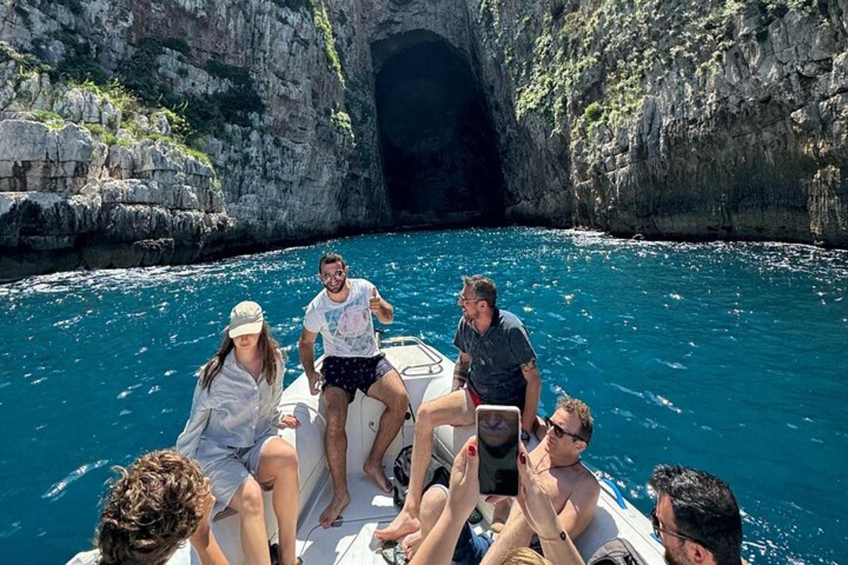 a group of people on a boat in the water