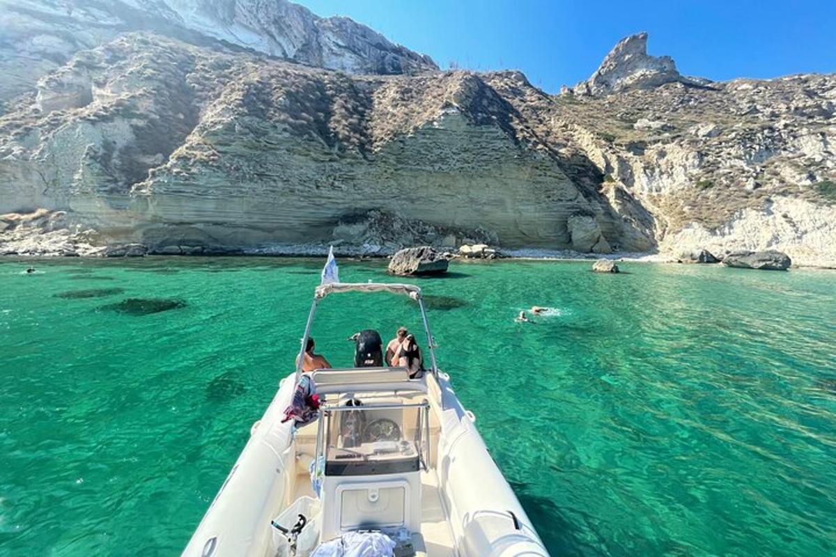 a group of people on a boat in the water
