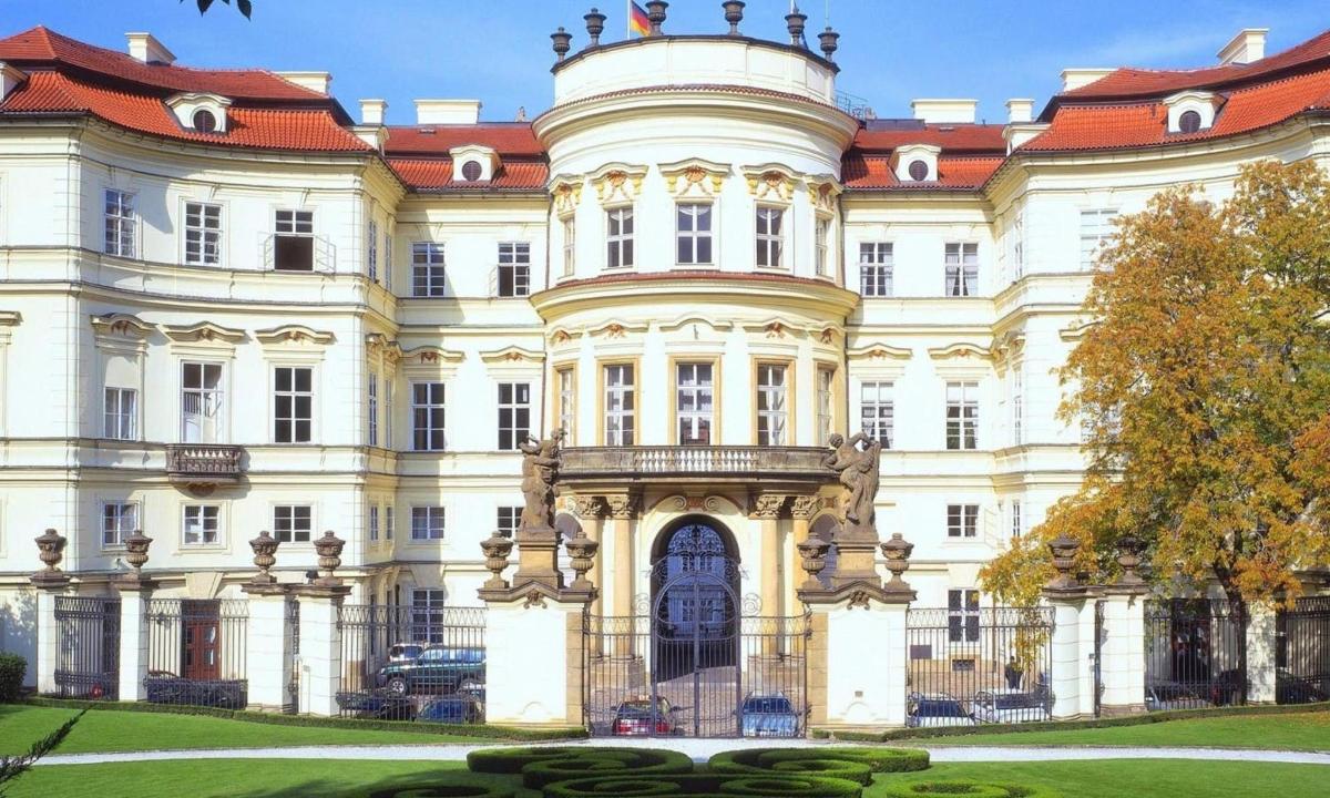 a large white building with a red roof