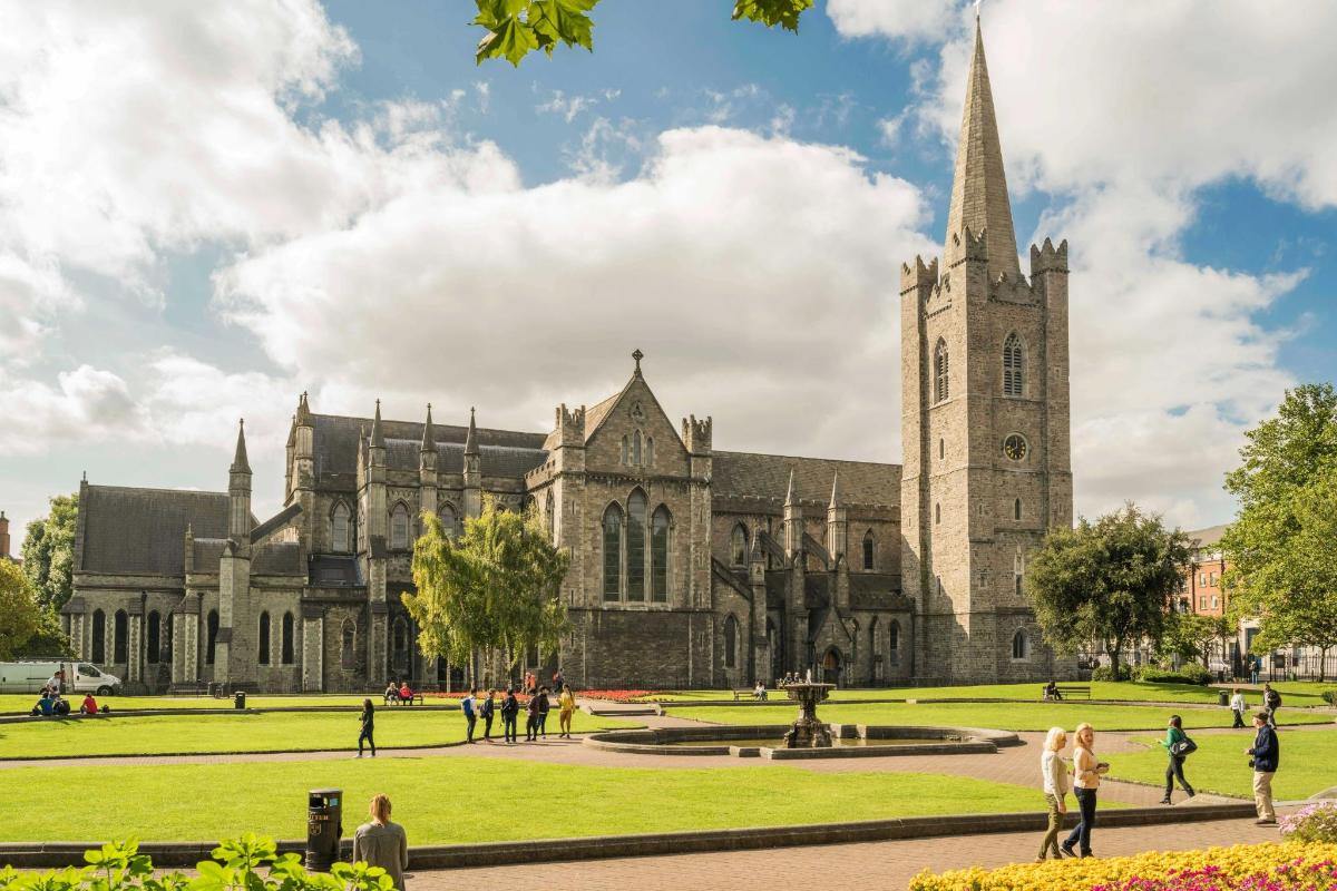 an image of a cathedral with people walking around it