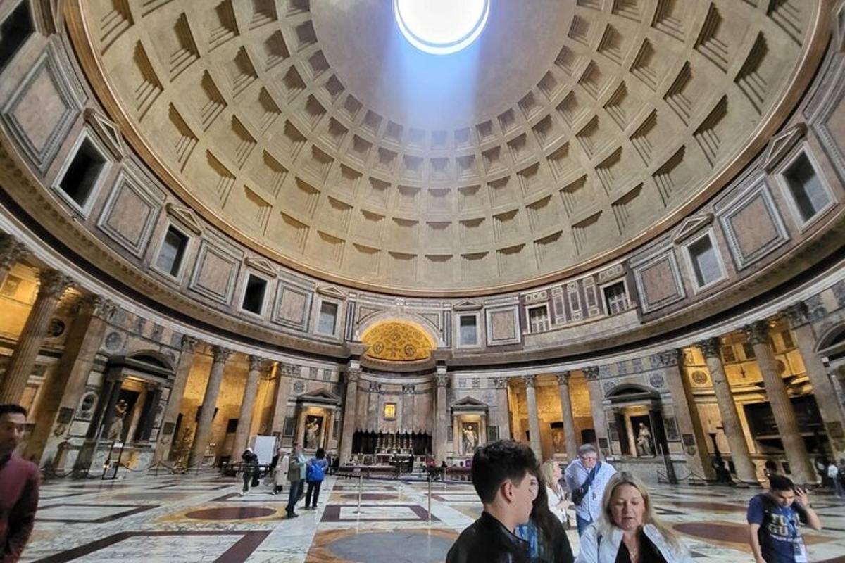 a group of people in a building with a dome