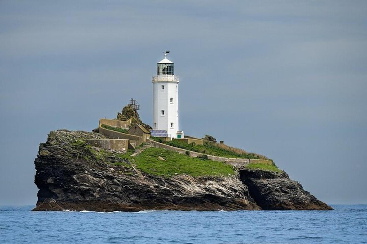 a lighthouse on a small island in the water