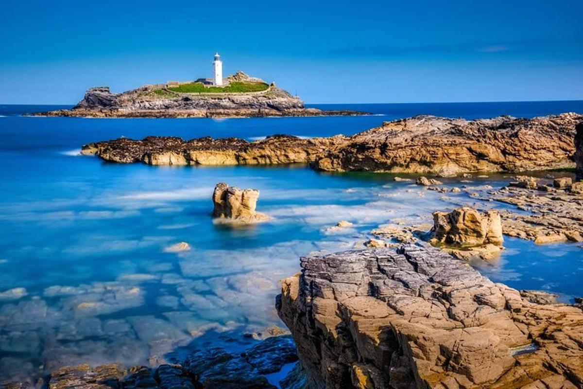 a lighthouse on a small island in the ocean