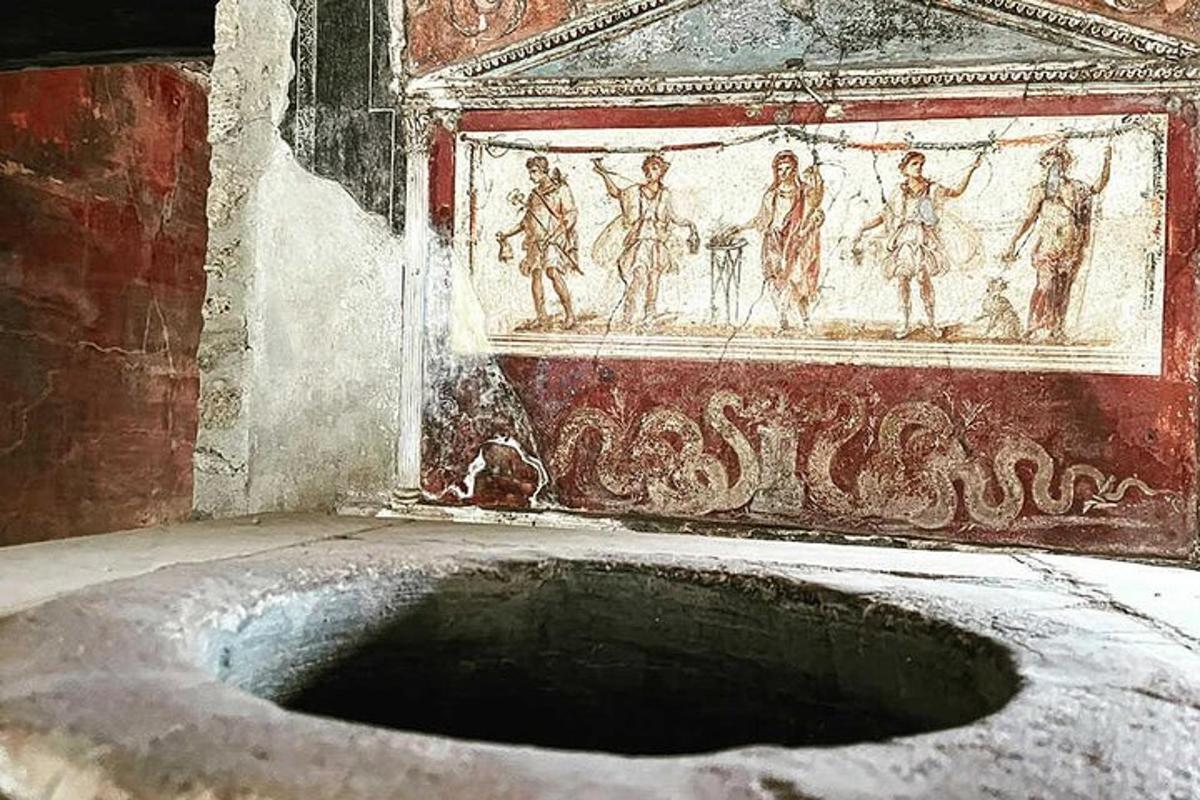 a bath tub in a room with a painting on the wall