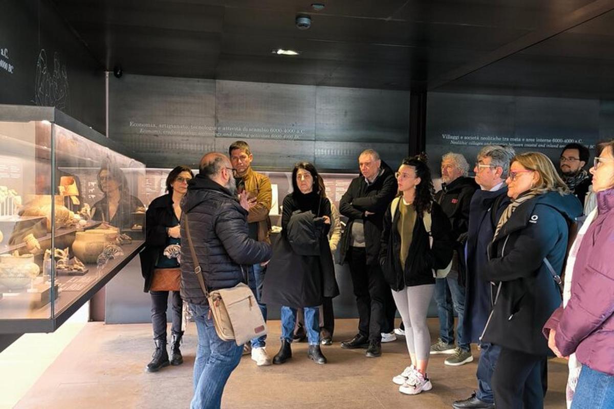 a group of people looking at a display in a museum