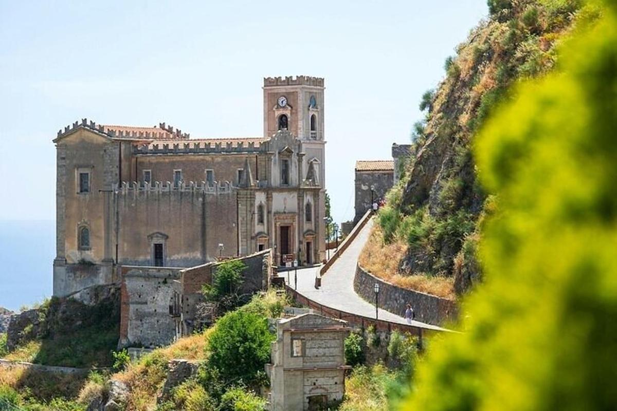 an old building on the side of a hill