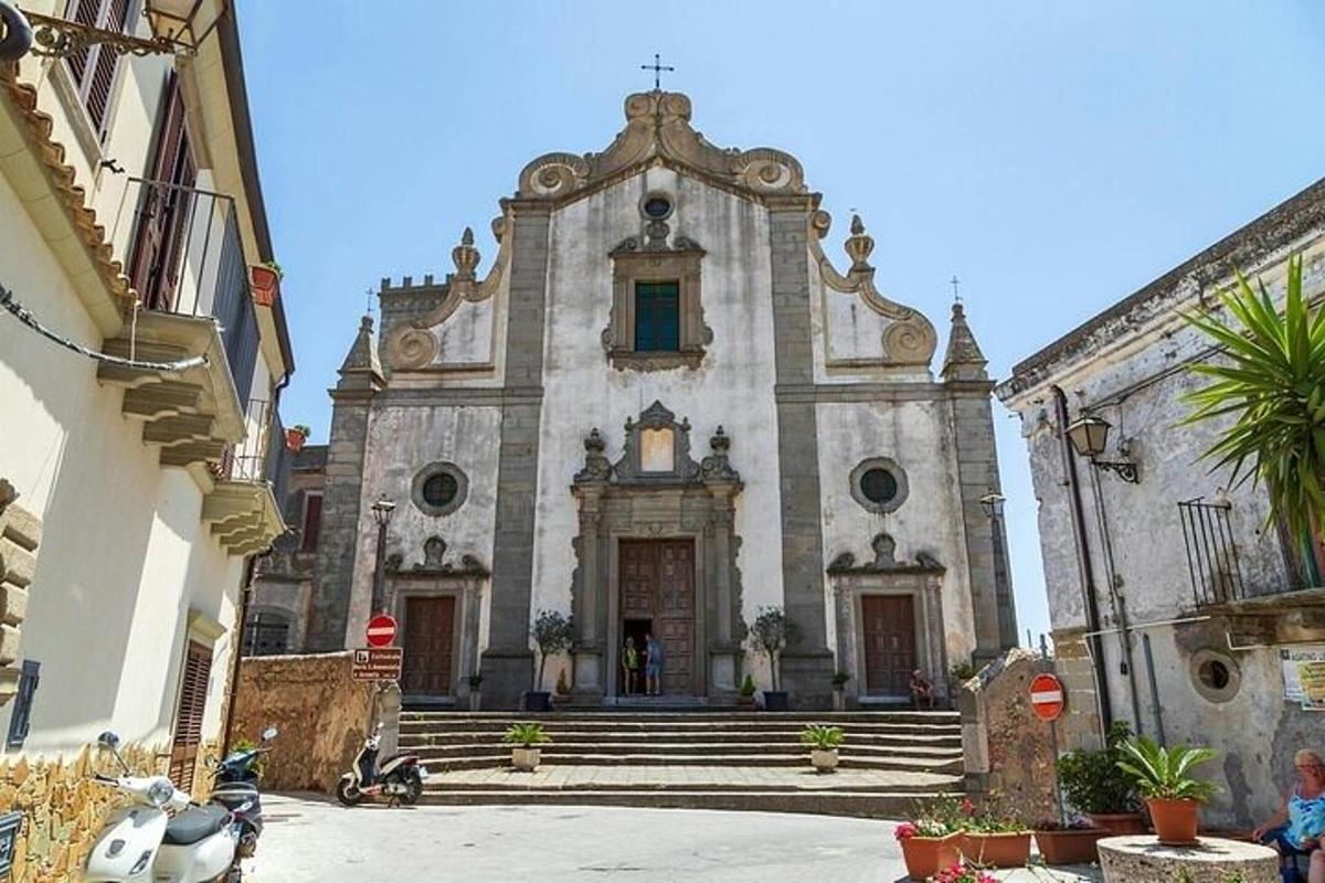 an old building with stairs and a church
