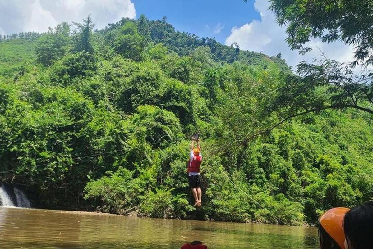 isang lalaki ang nakatayo sa tubig sa isang ilog