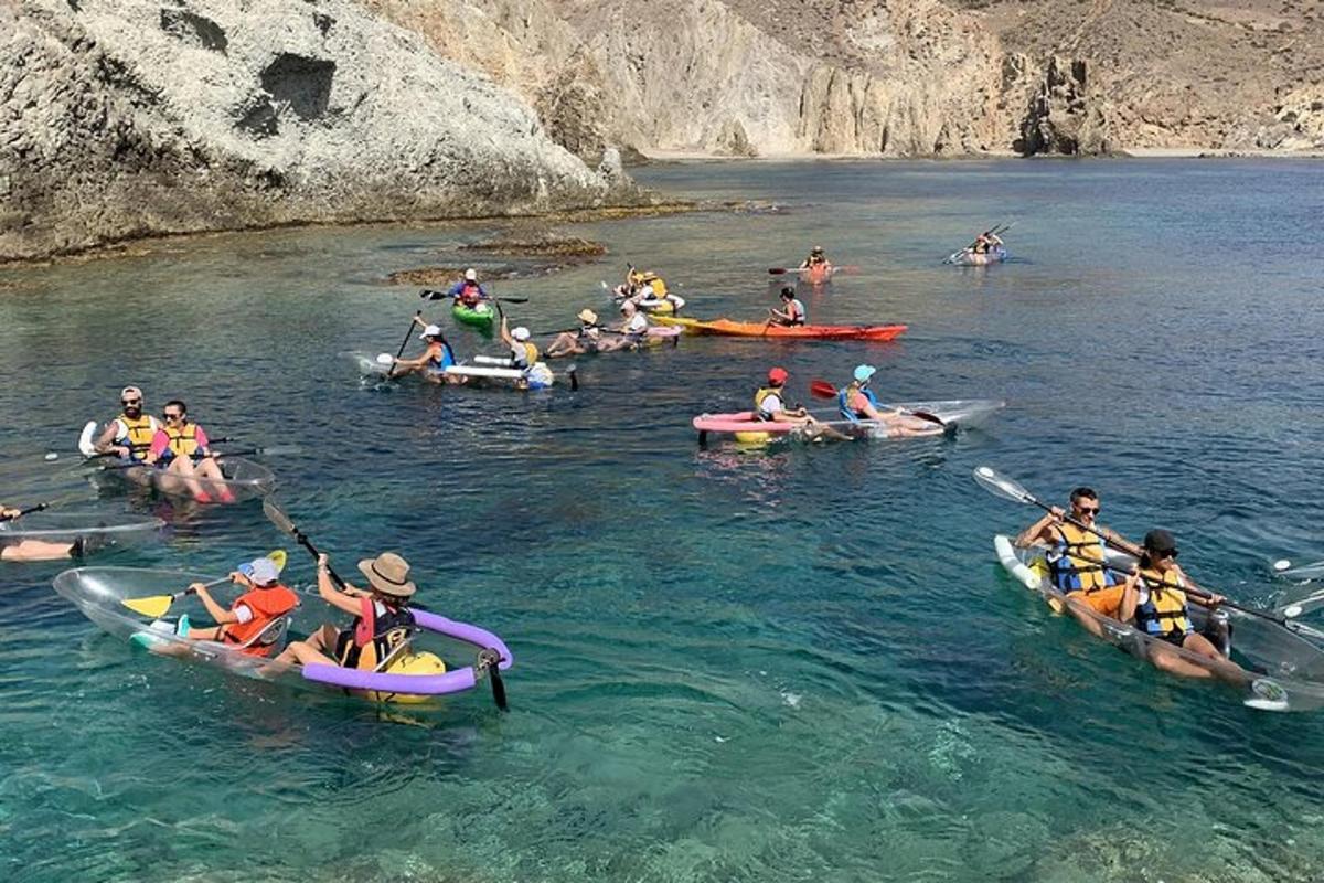 a group of people in kayaks in the water