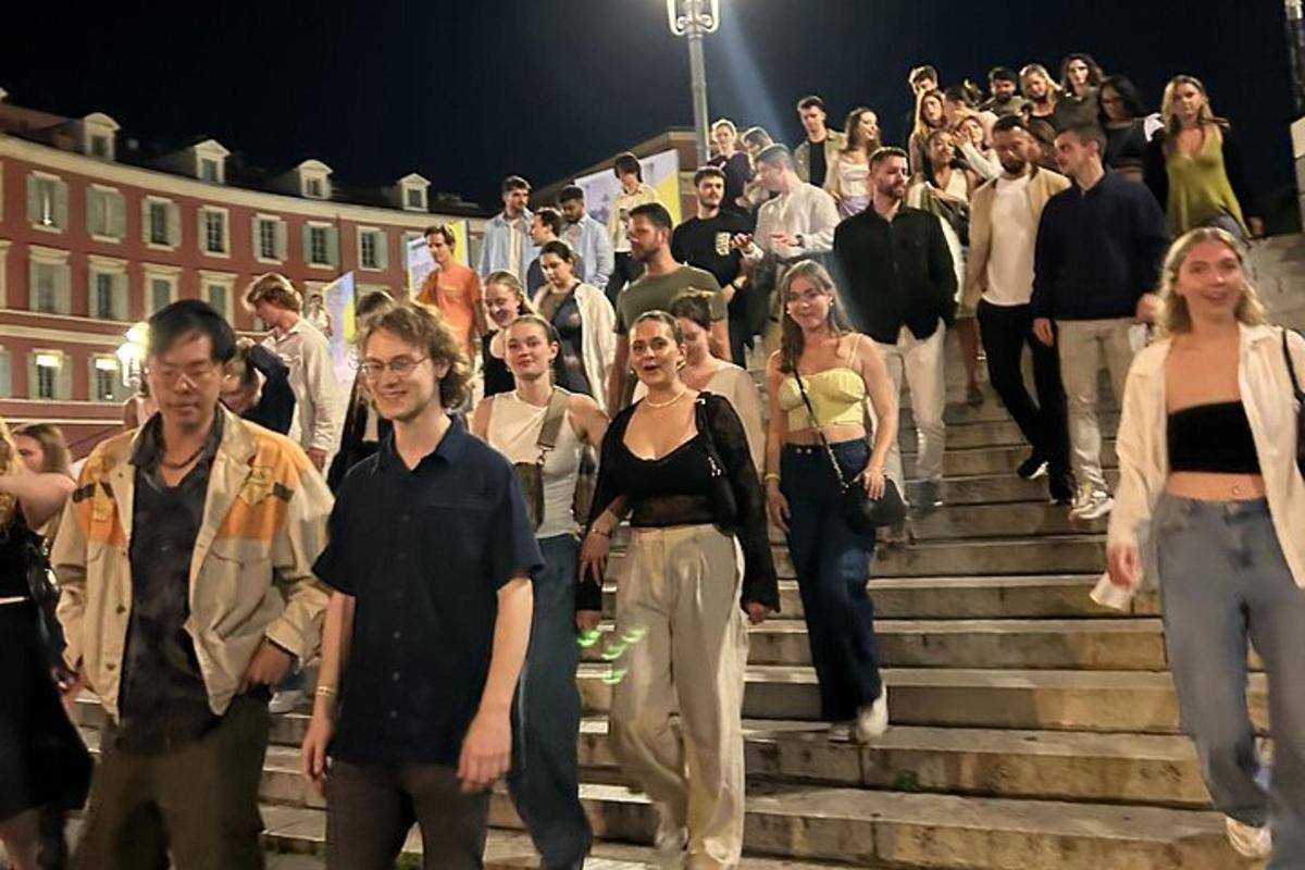 a large group of people walking up the stairs