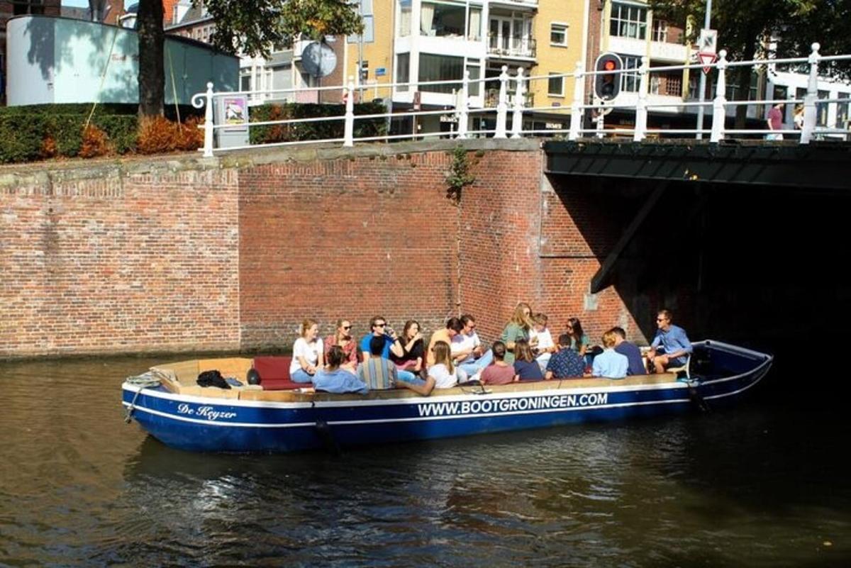 a group of people in a blue boat in the water