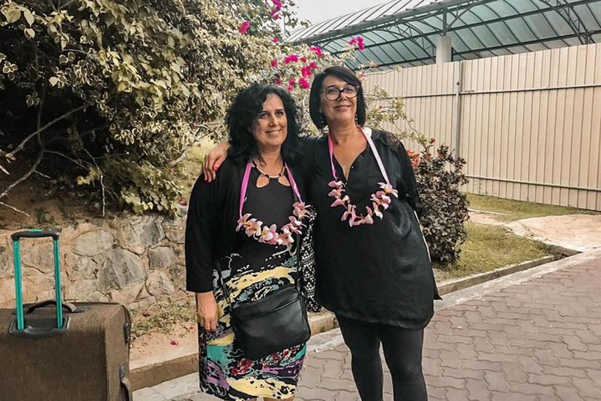 two women are standing next to each other