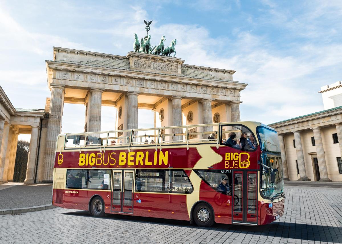 a double decker bus in front of a building