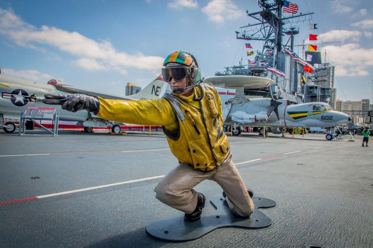 a statue of a man riding a skateboard on a ship
