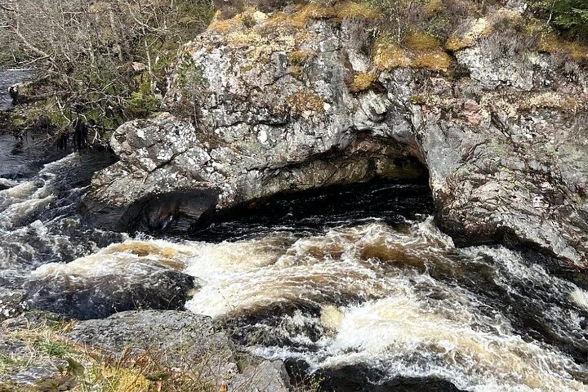 a stream of water with rocks in a river