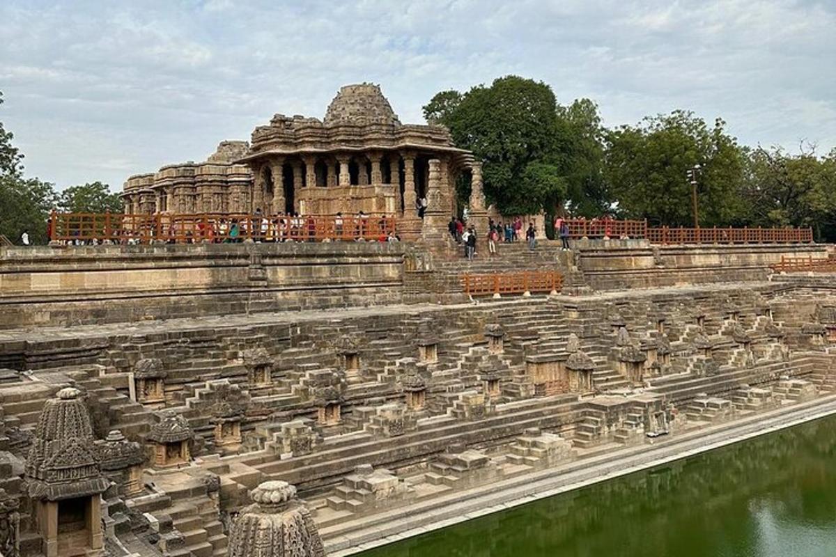 a large stone building with water in front of it