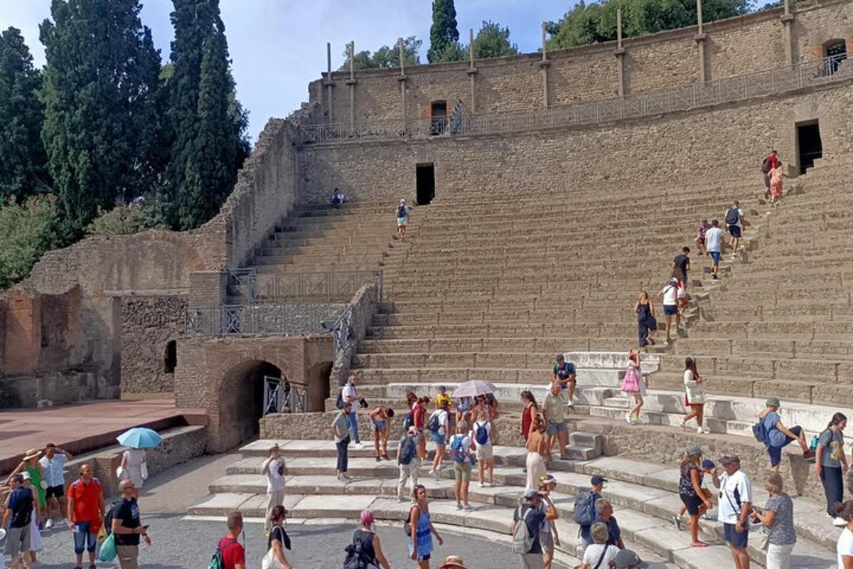 a group of people standing on the steps of an amphitheater