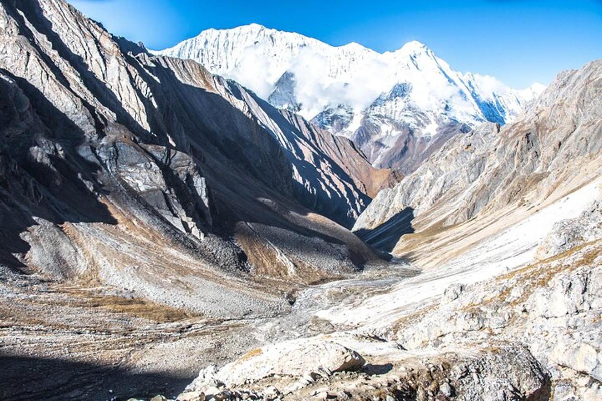 a view of a mountain range with snow covered mountains