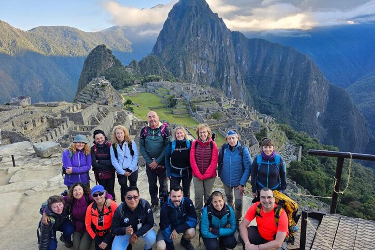 a group of people standing on top of a mountain