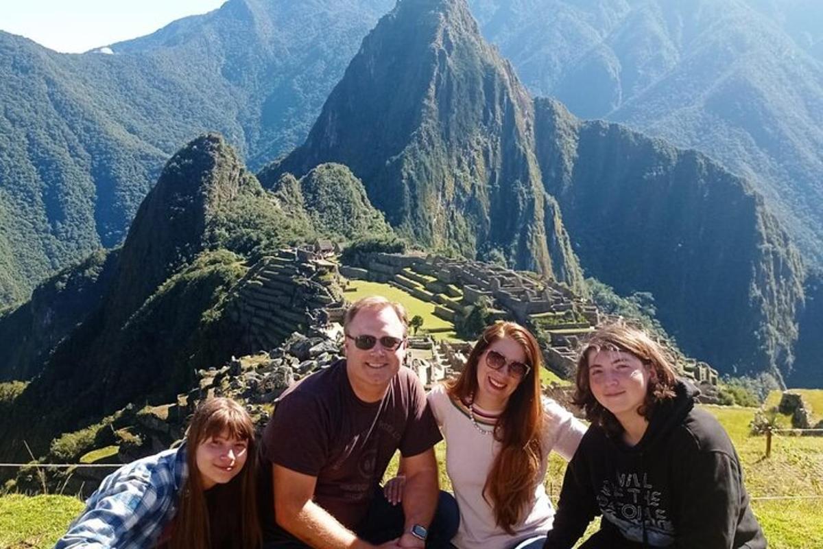 a group of people sitting on top of a mountain