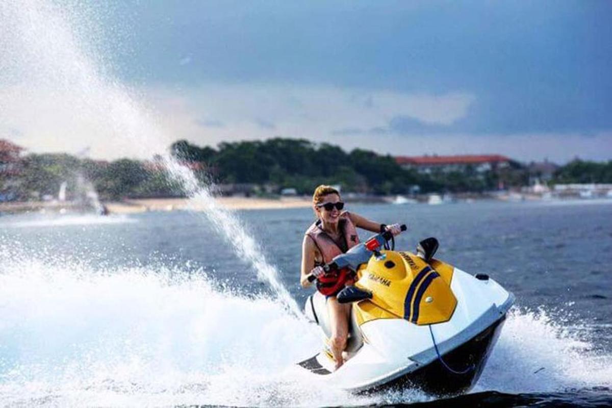 a man riding on a jet ski in the water