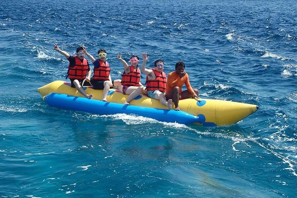 a group of people riding on a raft in the water
